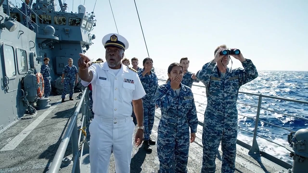 海上で作戦を遂行する海軍士官と乗組員、軍艦における軍人のリーダーシップとチームワークを示す