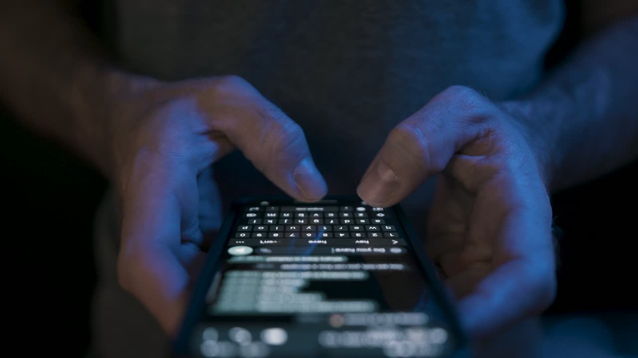 Caucasian hand typing extremely fast on a smartphone