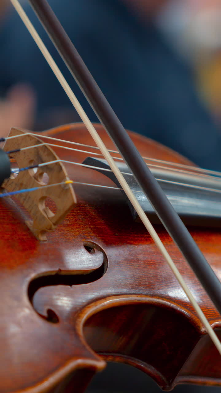 Close-up of a Violin Being Played with a Bow