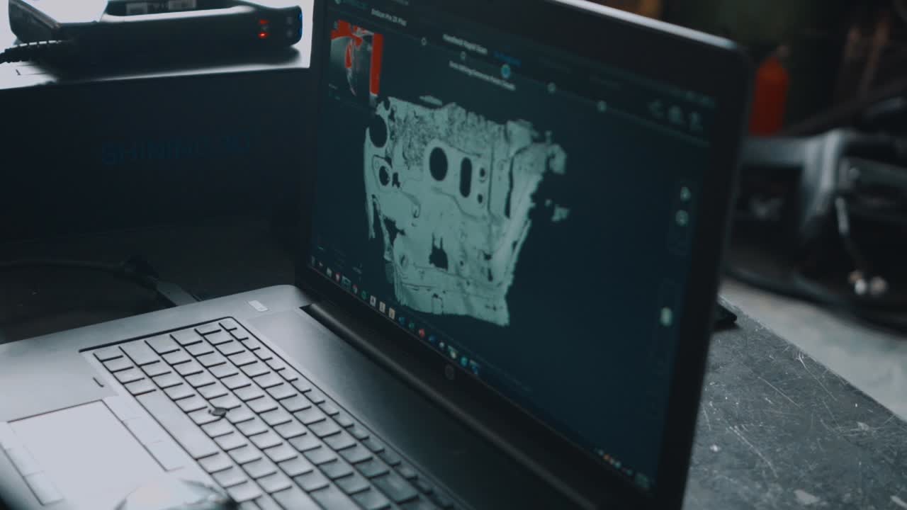 3D Model Rendering of a Mazda RX7 Firewall on a Laptop.
