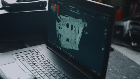 3d model rendering of a mazda rx7 firewall on a laptop.
