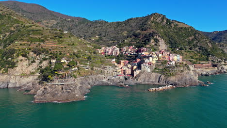 manarola village, part of cinque terre, located in italy by the beautiful coastline