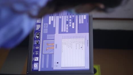 monitor displaying information about a patient as he is registered in a clinic's database to be scanned with a machine known as pet-ct, which scans patients with tumors in different parts of the body