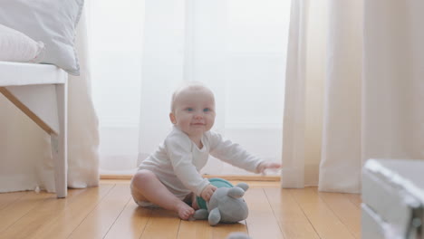 cute little baby boy playing with toys at home happy toddler learning having fun enjoying childhood