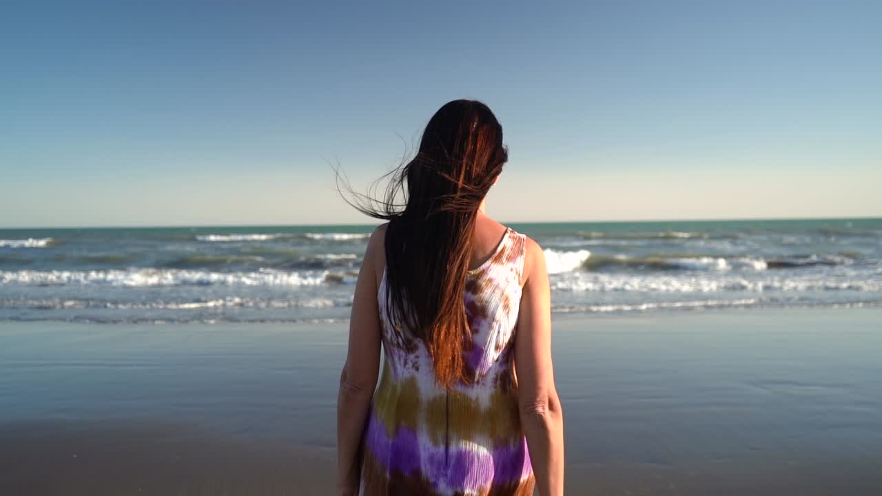 Woman Standing On Beachfront, Woman Walking On Shore - medium shot