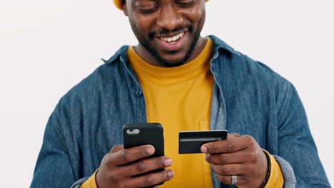 happy man, credit card and smartphone in studio