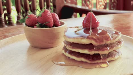 pancake with honey and strawberries