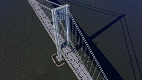 verrazano narrows bridge with passing cars and trucks