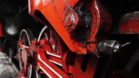 Detail-depth-of-field-shot-steel-parts-of-historic-steam-train-locomotive