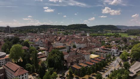 aerial view of aarau old town, riverside buildings, and green hills in aargau, switzerland