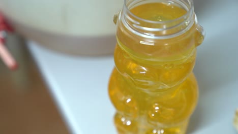Freshly Harvested Pure Honey In A Jar. High Angle Shot