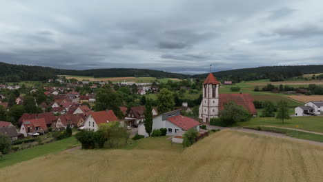 aerial retreat from rural german chapel