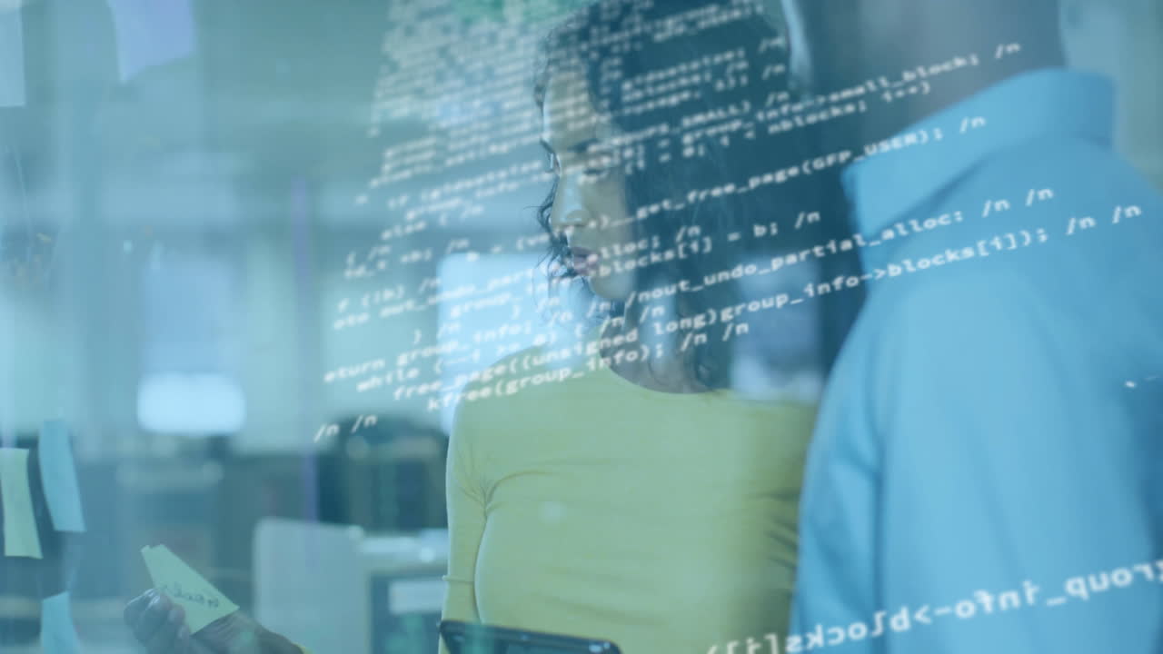 In office, business professionals collaborating with animation overlay on screens