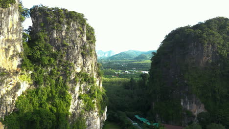 limestone cliffs of krabi district in thailand, rising aerial shot