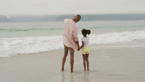 family enjoying free time by the sea