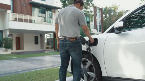 progressive idea of charging electric vehicle via cable from charging station.