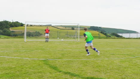 male and female soccer players, one player shooting at goal and scores point on pitch