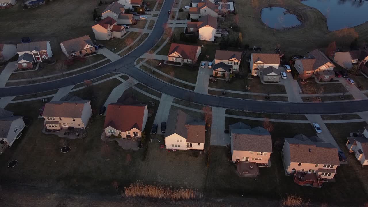 Flat Rock township with private housing during sunset, aerial view