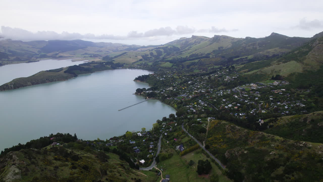 Aerial overview of the Governors bay village in cloudy Canterbury, New Zealand