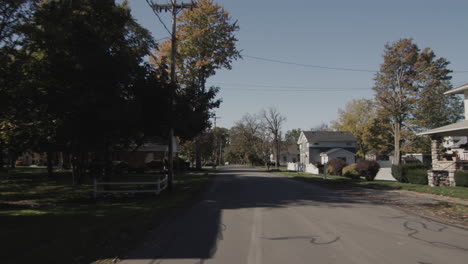 Drive-forward-on-a-road-through-a-typical-American-city.-Rear-window-view