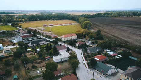 drone shot over village houses and building site