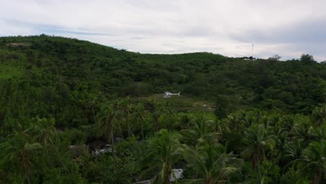 Helicopter-On-The-Vast-Greenery-In-Fiji-On-A-Cloudy-Day---aerial