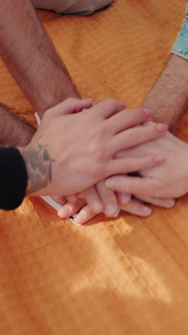 Friends Playing Cards and Enjoying Picnic