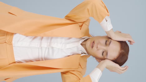 vertical video of business woman with headache.
