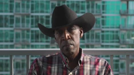 portrait shot of black man with black cowboy hat