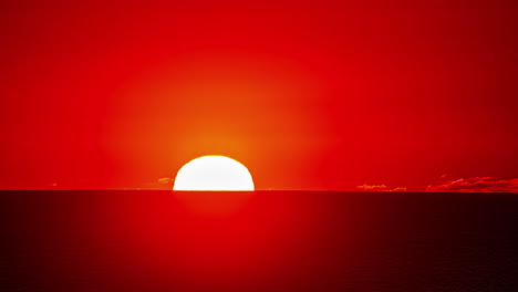 lapso de tiempo de la puesta de sol grande, brillante y amarilla en el horizonte rojo