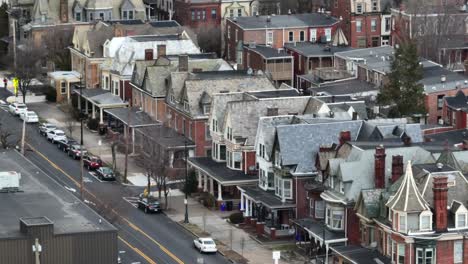 long aerial zoom of row houses in historic american city