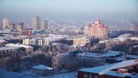 snowy cityscape at sunrise