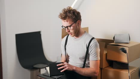 A-young-man-is-counting-parcels-in-a-notebook