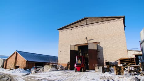 forklift loading at a warehouse in winter