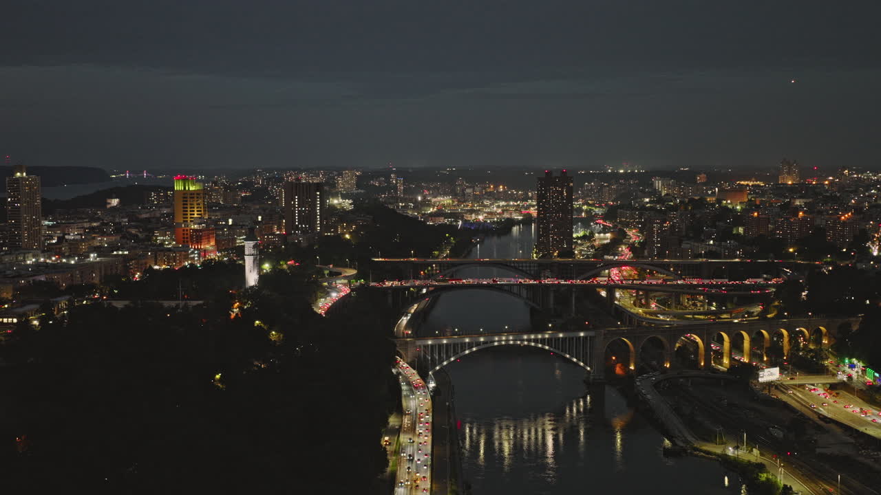 NYC New York Aerial v263 drone flyover Harlem river capturing bridges crossings, peak hours traffic and night cityscape of Highbridge in Bronx at dusk - Shot with Inspire 3 8k - September 2023