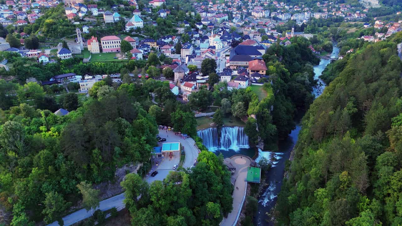 aerial drone view of Jajce, Bosnia and Herzegovina a historic town surrounded by mountains, waterfall and medieval fortress