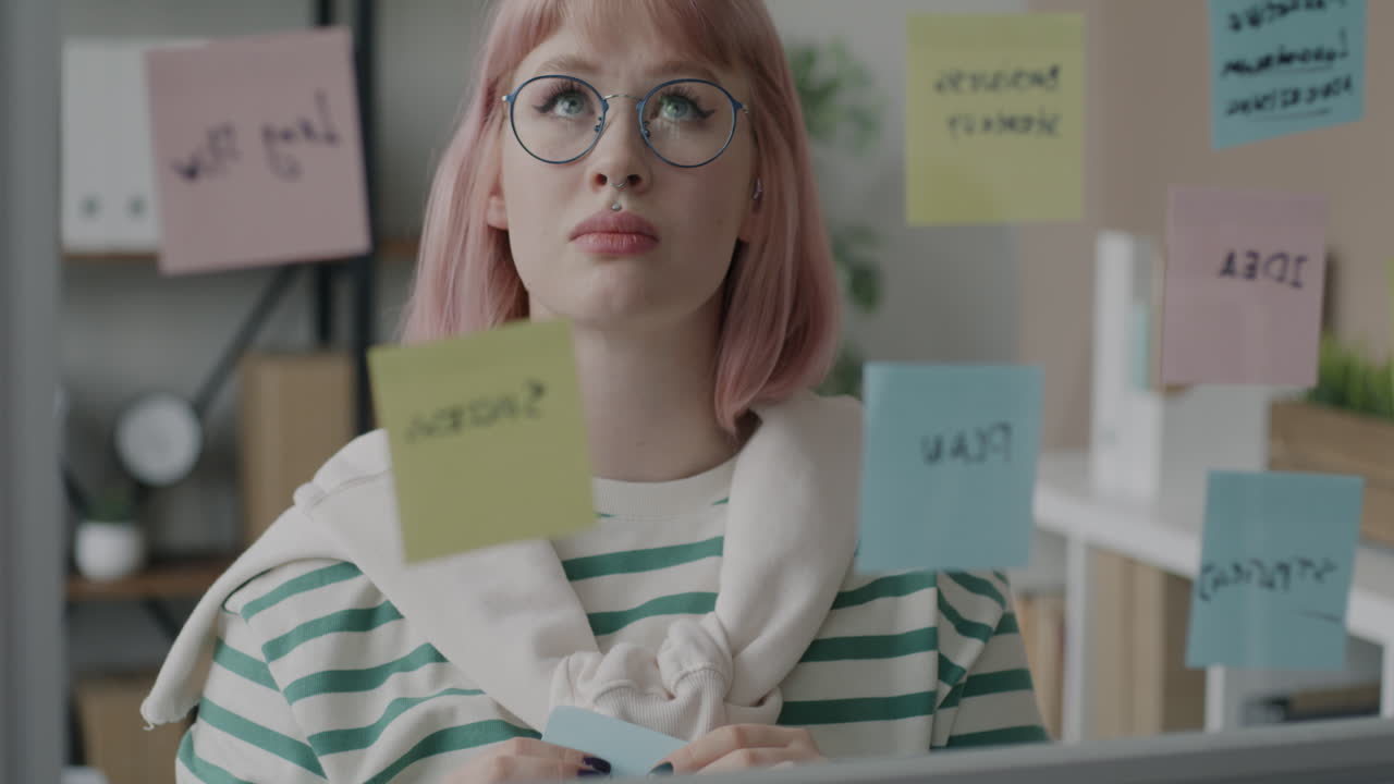 Woman Brainstorming with Post-it Notes