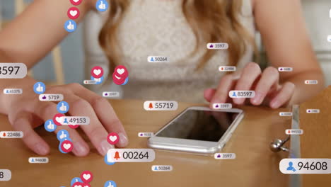 animation of social media icons over woman using smartphone