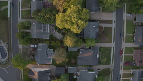 straight down view of suburban houses camera pulls down street