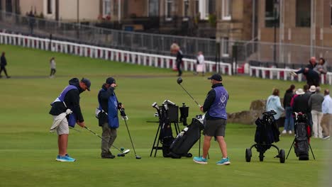 golfers preparing for a shot on the field