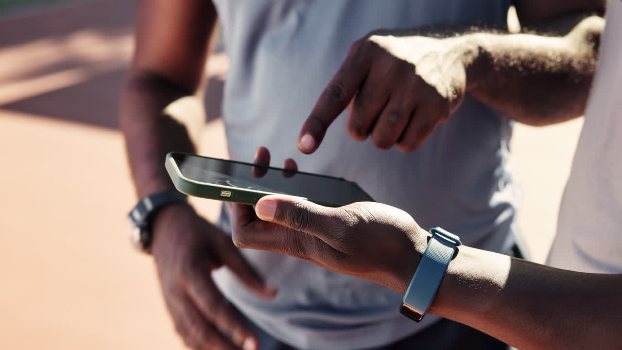 People using a smartphone outdoors