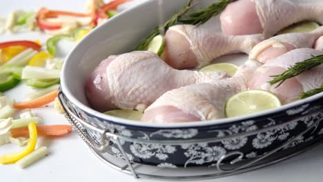 preparing chicken legs with vegetables