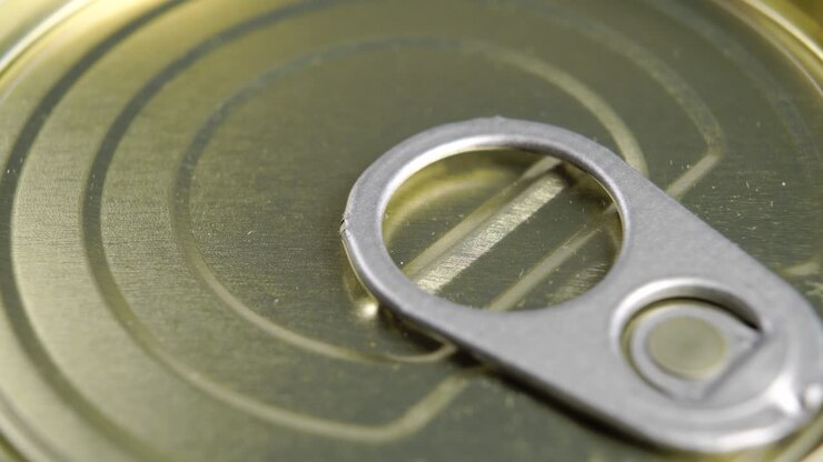 Closed tin can with pull ring. Conserved food metal container. Macro