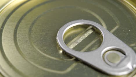 closed tin can with pull ring. conserved food metal container. macro