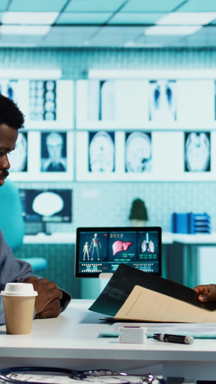 Medical Professionals Reviewing X-Ray Scans and Patient Files