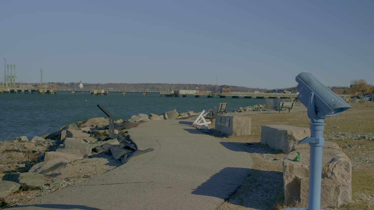Binoculars On Shore Of Portland In Maine, USA. wide shot