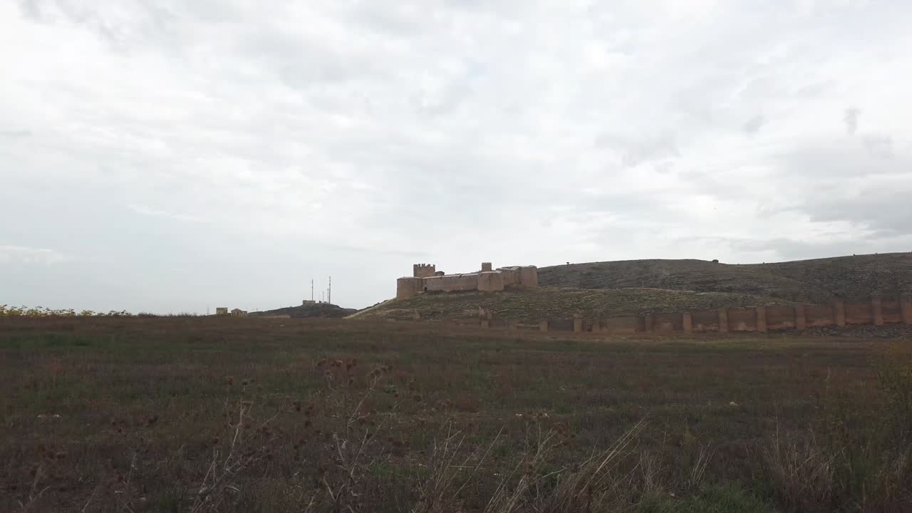 Passing by the Castillo of Berlanga de Duero showing castle and ramparts.