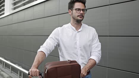 businessman with bicycle walking