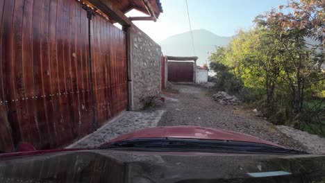 Red-car,-waiting-to-enter-garage