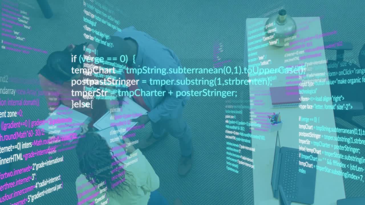Colleagues opening code folder and pointing highlights by exchanging sheets near laptop for review